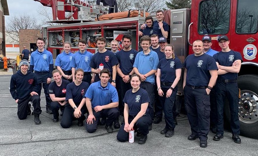 Naperville Fire Explorers Many Naperville Fire Explorers pose in front of a Naperville fire truck