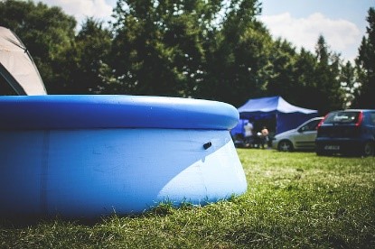 a temporary above-ground pool in the lawn