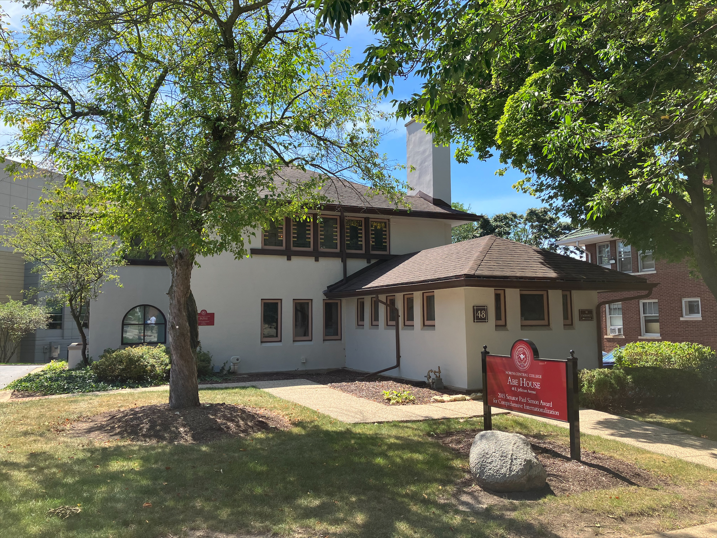 a brown and white two-story single family home